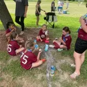 Soccer team sitting on the field