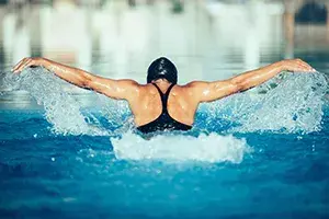 Woman swimming in pool